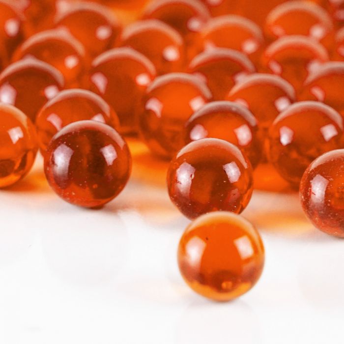 glass round orange marbles