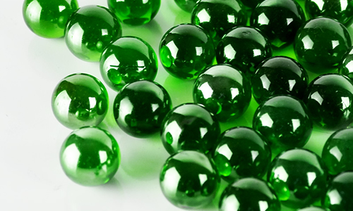 green-glass-round-marbles